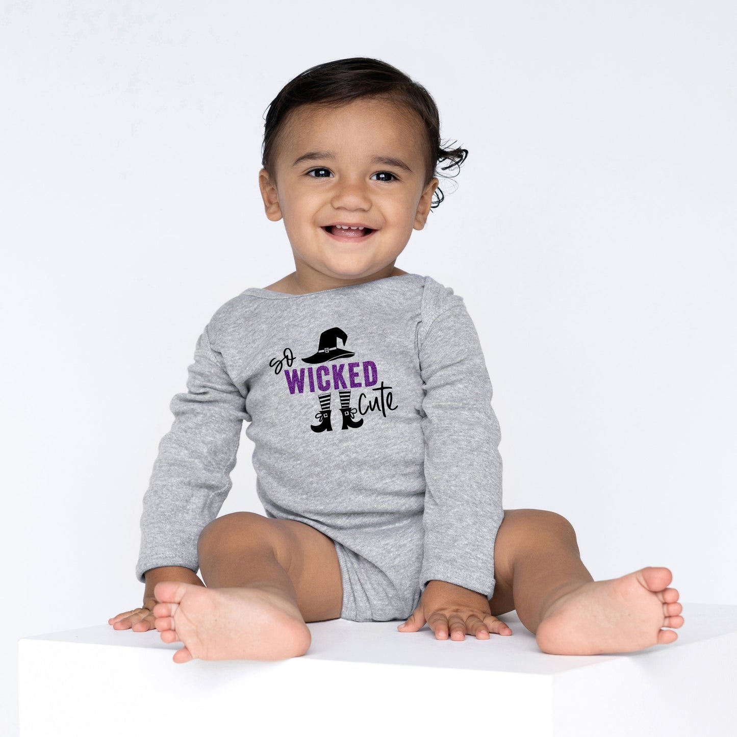 So Wicked Cute Glitter | Baby Graphic Long Sleeve Bodysuit