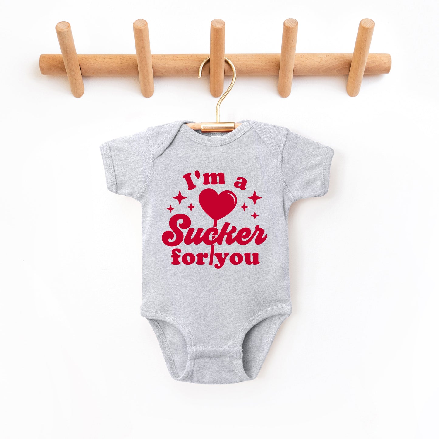 Sucker For You | Baby Graphic Short Sleeve Bodysuit