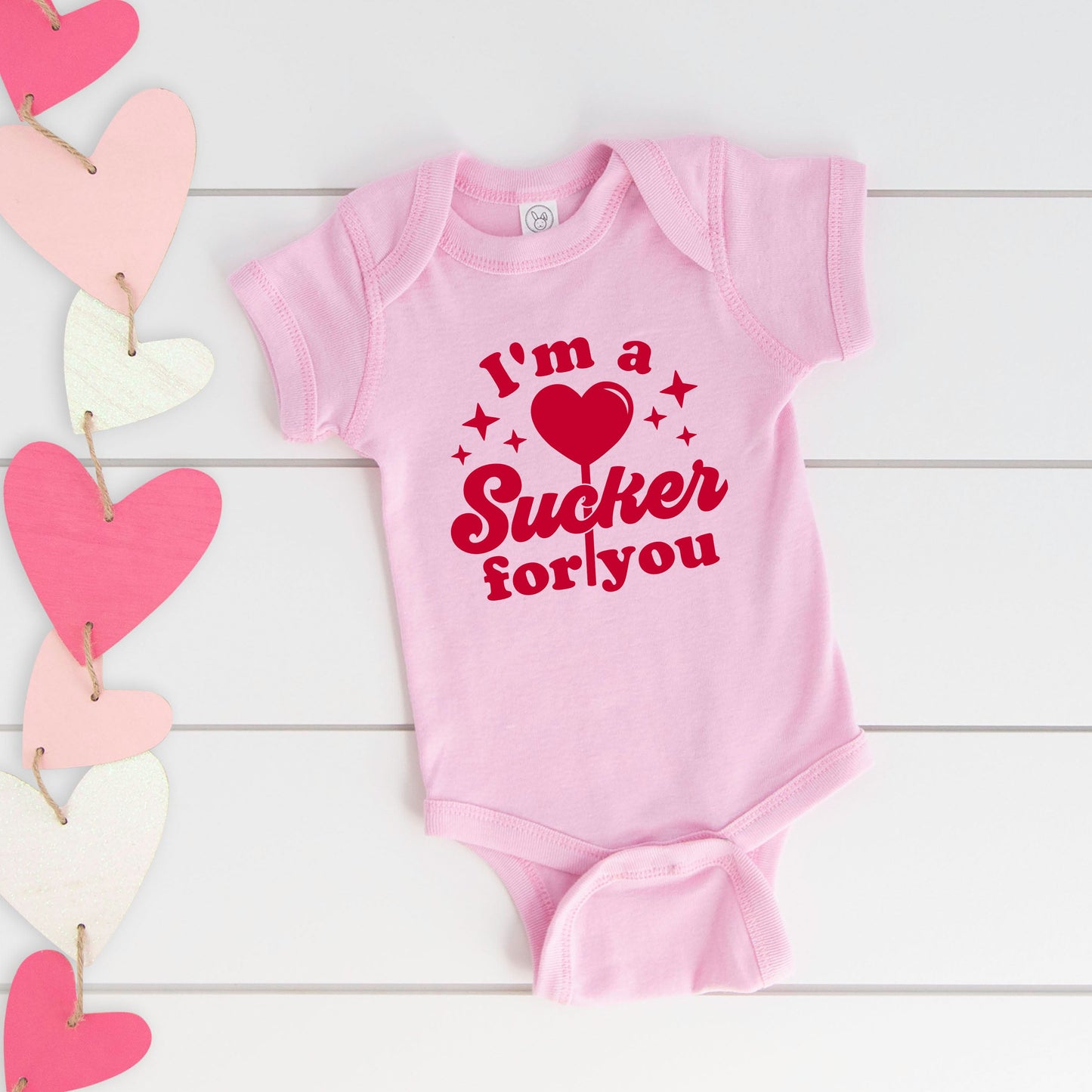 Sucker For You | Baby Graphic Short Sleeve Bodysuit