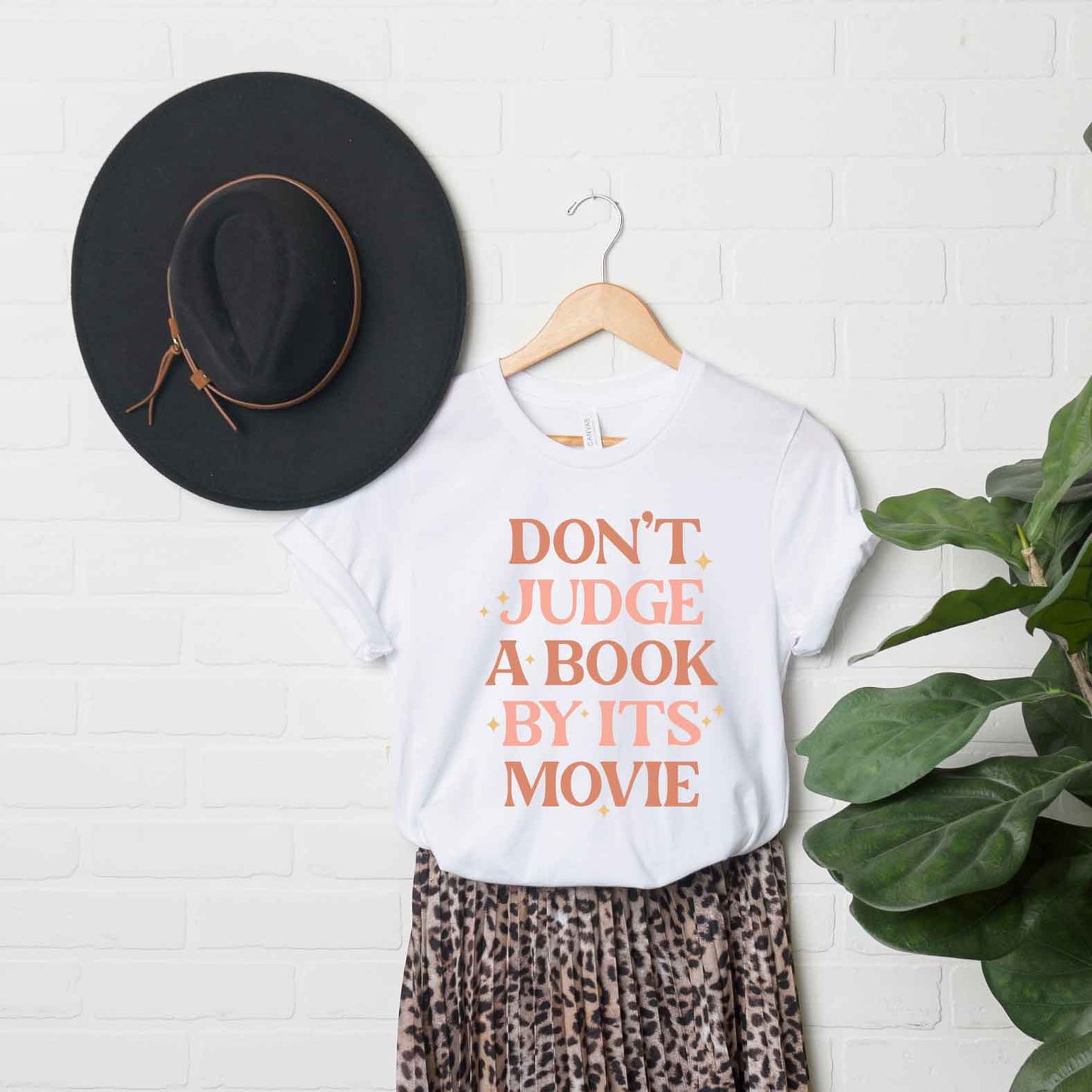 Don't Judge A Book By It's Movie | Short Sleeve Graphic Tee