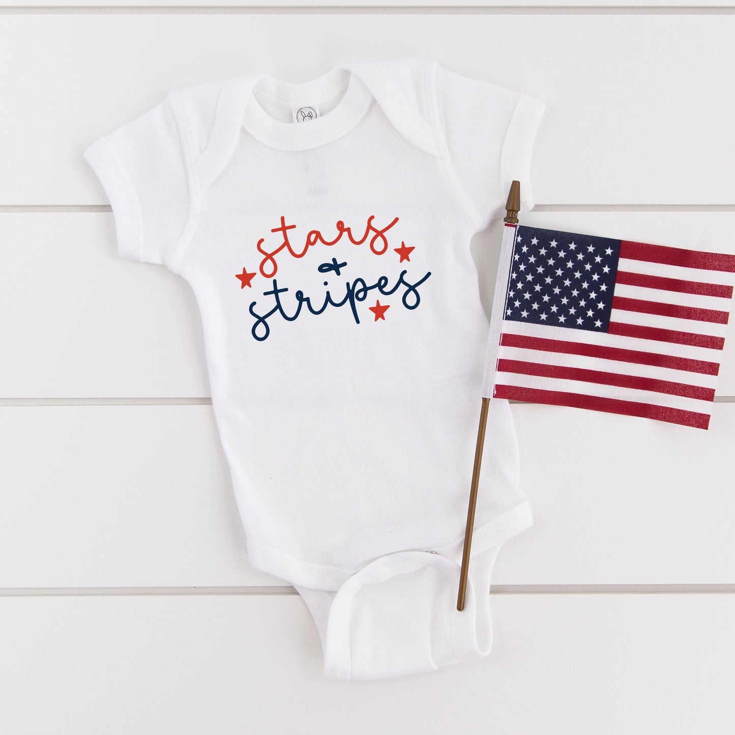 Patriotic Stars and Stripes Cursive | Baby Graphic Short Sleeve Bodysuit